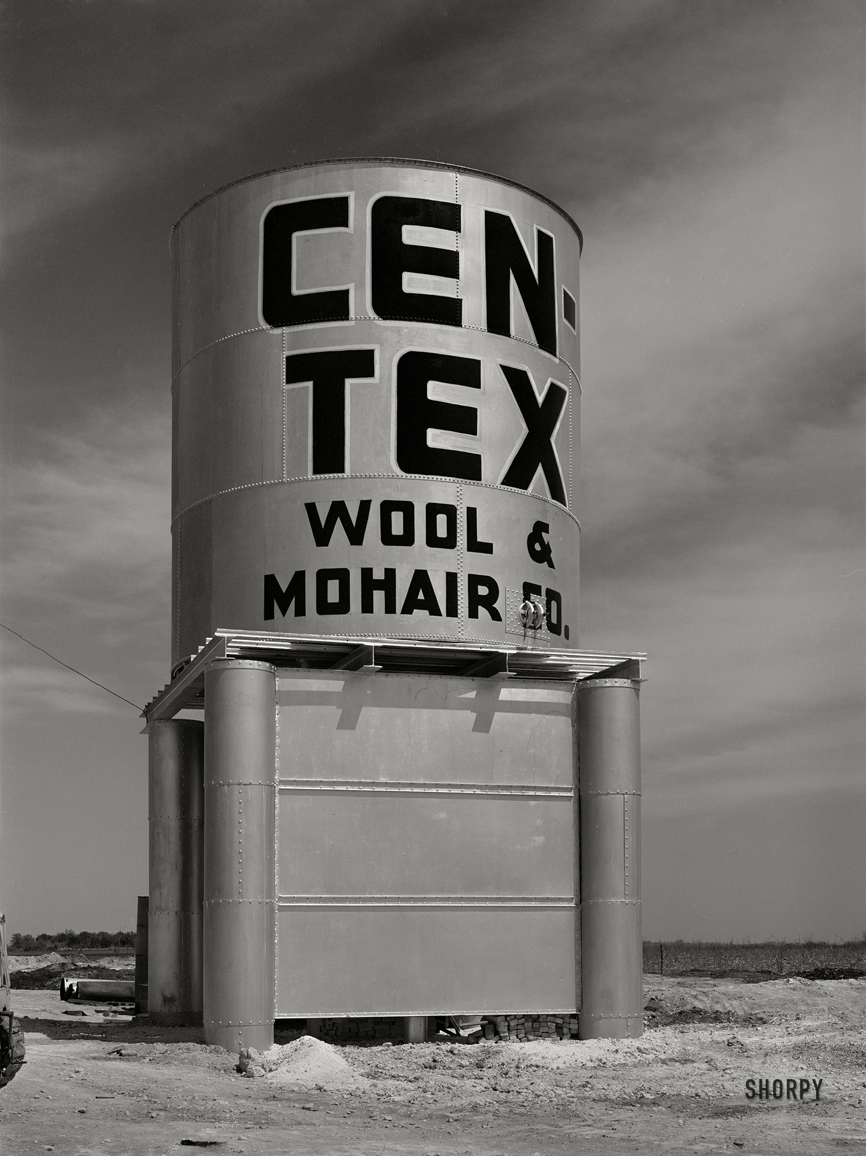 March 1940. "Water storage tank at wool and mohair scouring plant in San Marcos, Texas." Acetate negative by Russell Lee for the Farm Security Administration. View full size.