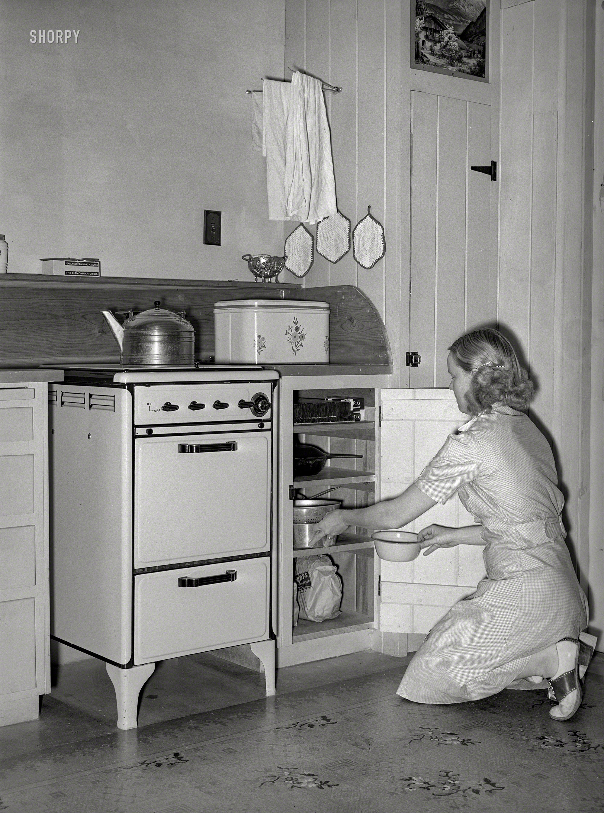 May 1940. "Wife of member of the Arizona part-time farms, Chandler Unit, Maricopa County, at her kitchen stove." Photo by Russell Lee. View full size.