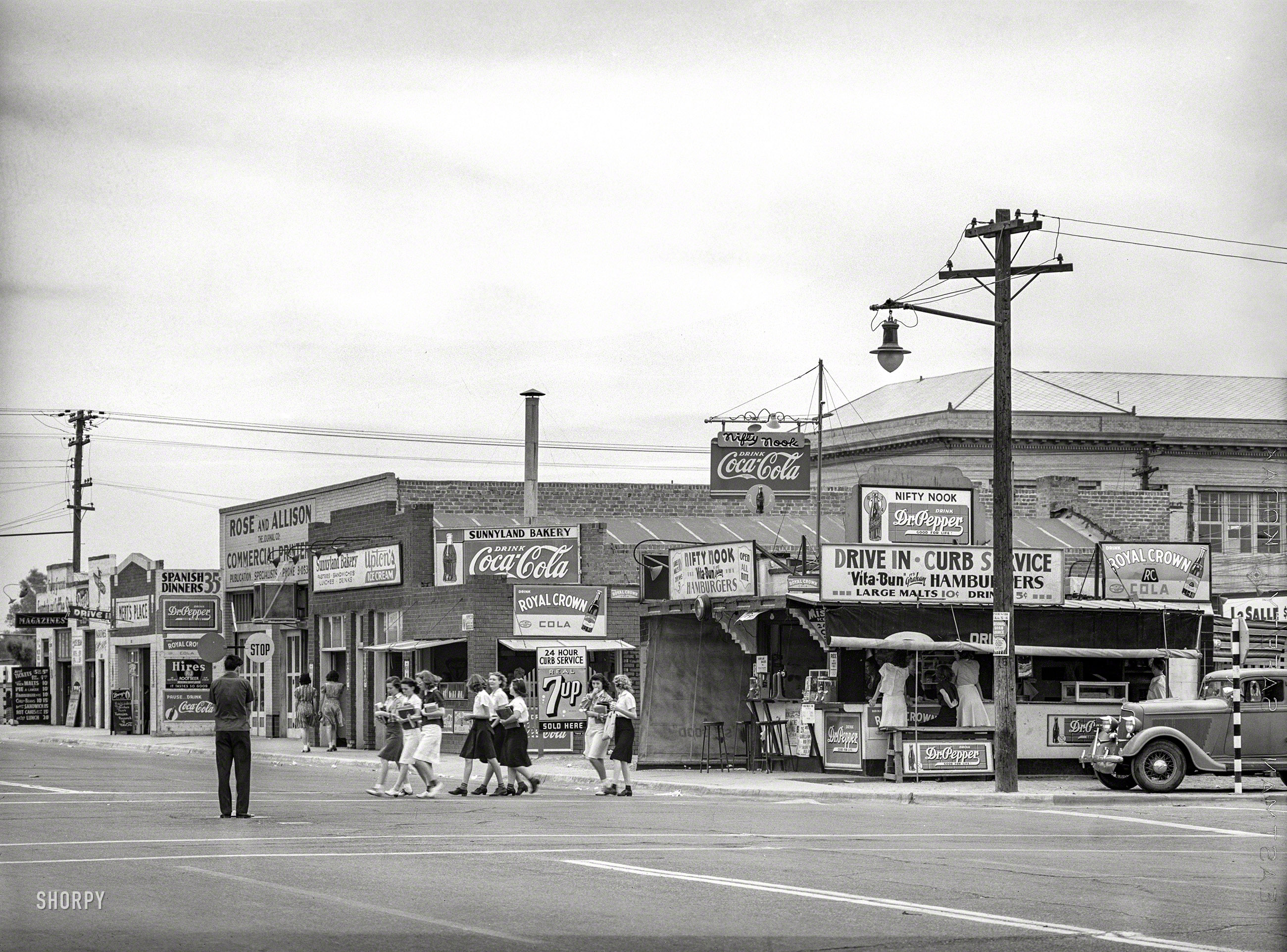May 1940. "High school students crossing the street. Phoenix, Arizona." Medium format negative by Russell Lee for the Farm Security Admin. View full size.