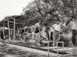 April 1940. Coolidge, Arizona. "Swimming pool at desert dude ranch." Medium format negative by Russell Lee for the Farm Security Admin. View full size.