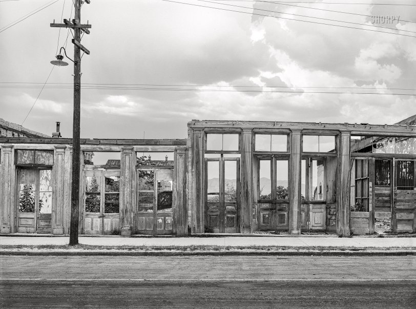 May 1940. "Shells of old buildings on the main street of Tombstone, Arizona. The near ghost town quality, as well as the reminders of more glamorous and exciting days, attract many tourists." Acetate negative by Russell Lee for the Farm Security Administration. View full size.