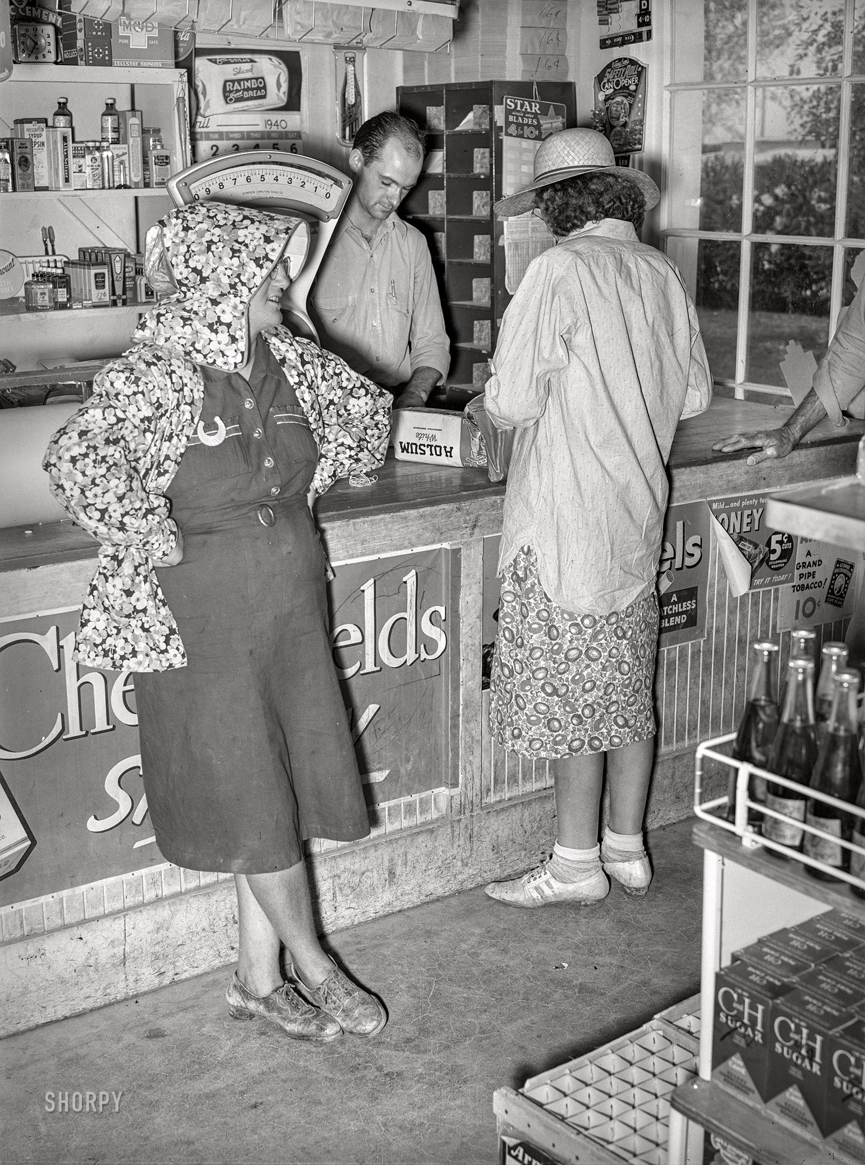 May 1940. "In the grocery store of the Casa Grande Valley Cooperative Farms. Pinal County, Arizona." Acetate negative by Russell Lee for the Farm Security Administration. View full size.