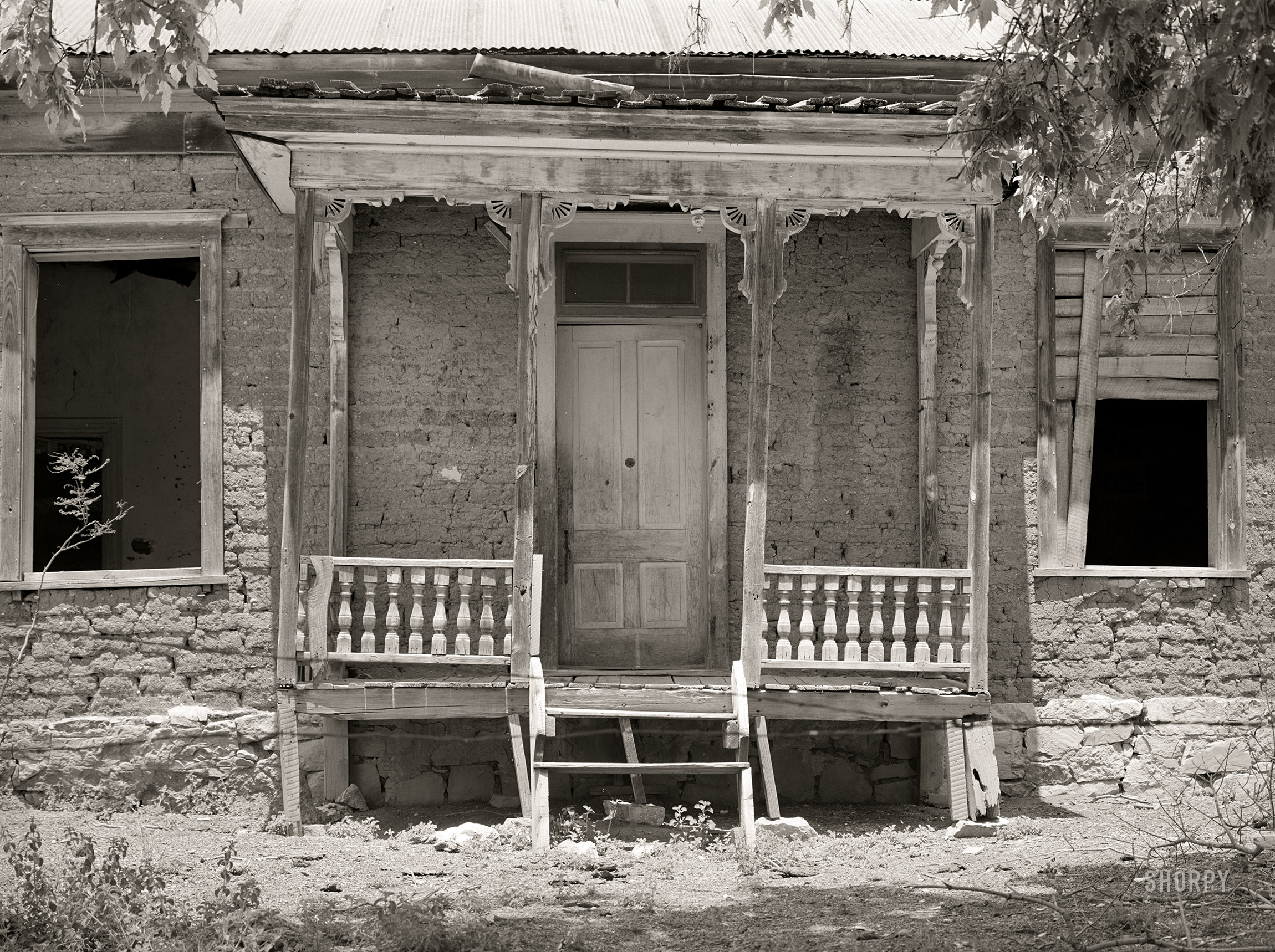 May 1940. "Front of abandoned residence in Georgetown, New Mexico. Ghost gold mining town." Acetate negative by Russell Lee for the Farm Security Administration. View full size.