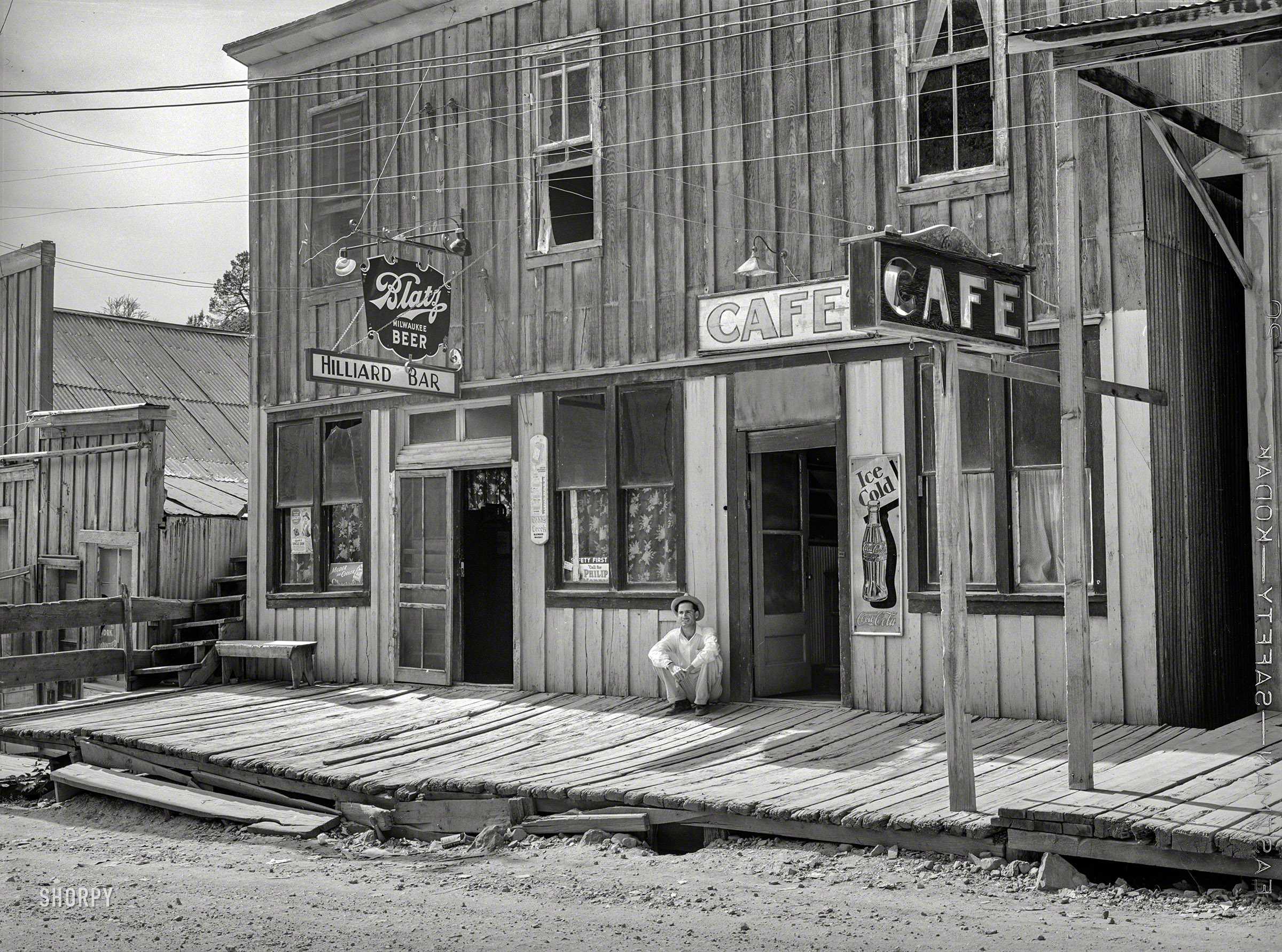 June 1940. "Cafe and bar in Mogollon, New Mexico." Medium format negative by Russell Lee for the Farm Security Administration. View full size.