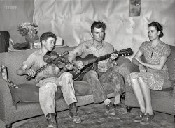 June 1940. "Farmer, his wife, and brother in close harmony. Pie Town, New Mexico." Nitty, Gritty and Pretty. Medium format negative by Russell Lee for the Farm Security Administration. View full size.