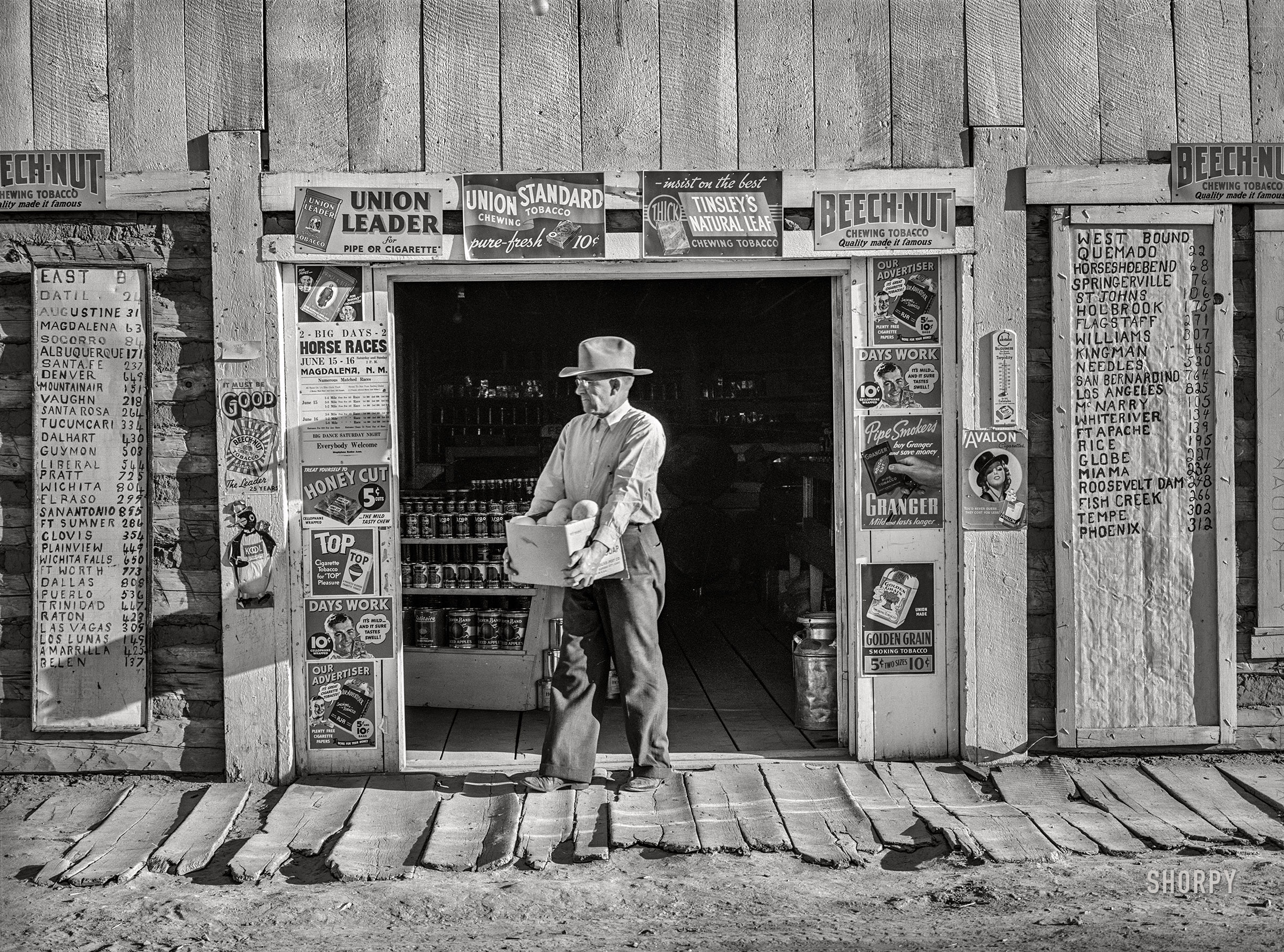 June 1940.  "Mr. Keele, merchant and president of the Farm Bureau, in front of the general store. Pie Town, New Mexico." Medium format negative by Russell Lee. View full size.