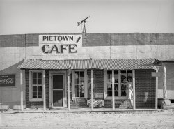 June 1940. "Cafe. Pie Town, New Mexico." Sporting the biggest accent west of the Mississippi. Medium format negative by Russell Lee for the Farm Security Administration. View full size.
