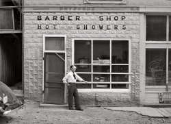 June 1940. "Barber shop at gold mining community of Mogollon, New Mexico." Medium format acetate negative by Russell Lee for the Farm Security Administration. View full size.