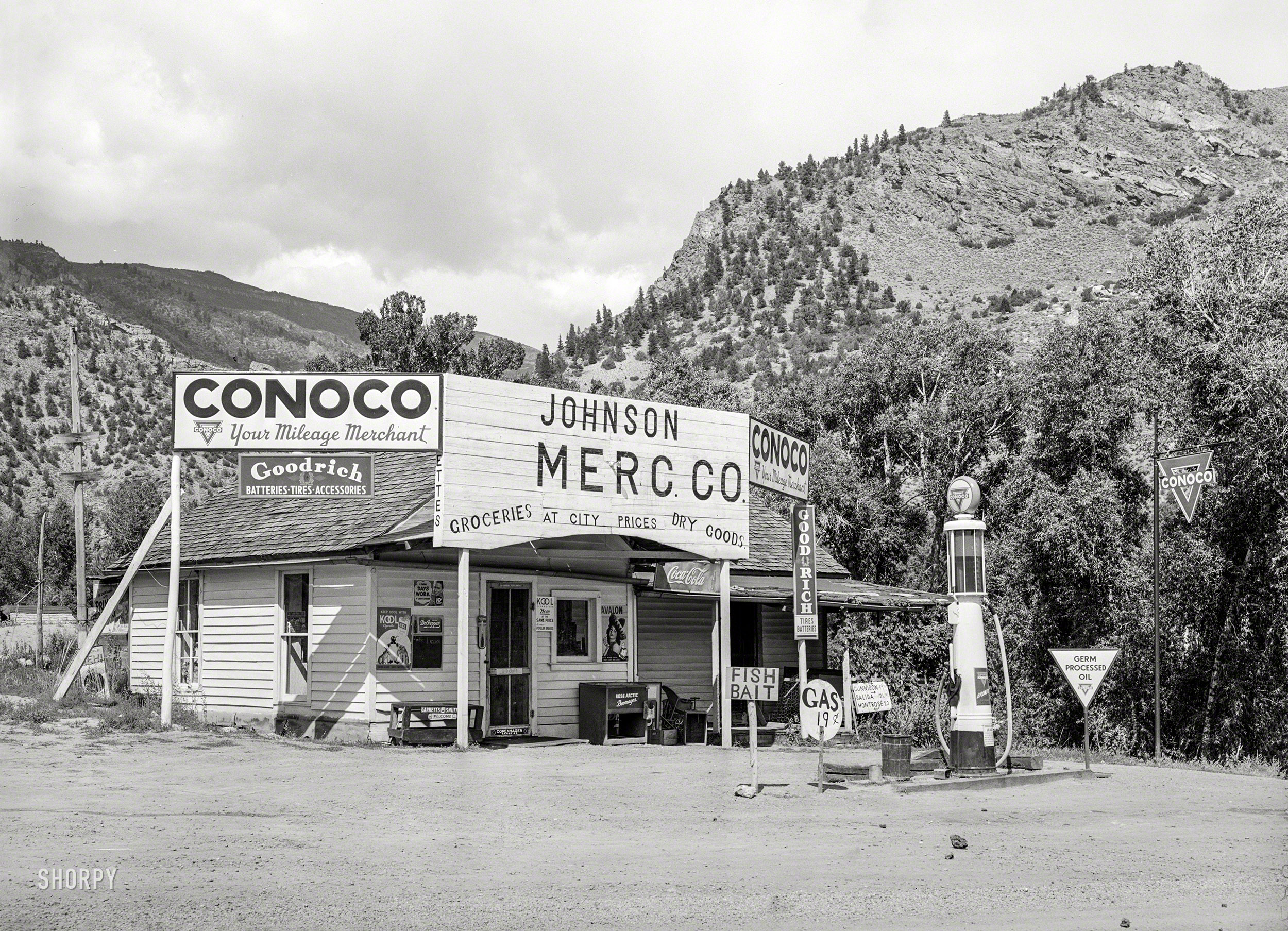 September 1940. "Grocery store and filling station at Cimarron, Colorado. This is a sheep shipping center." Medium format negative by Russell Lee. View full size.