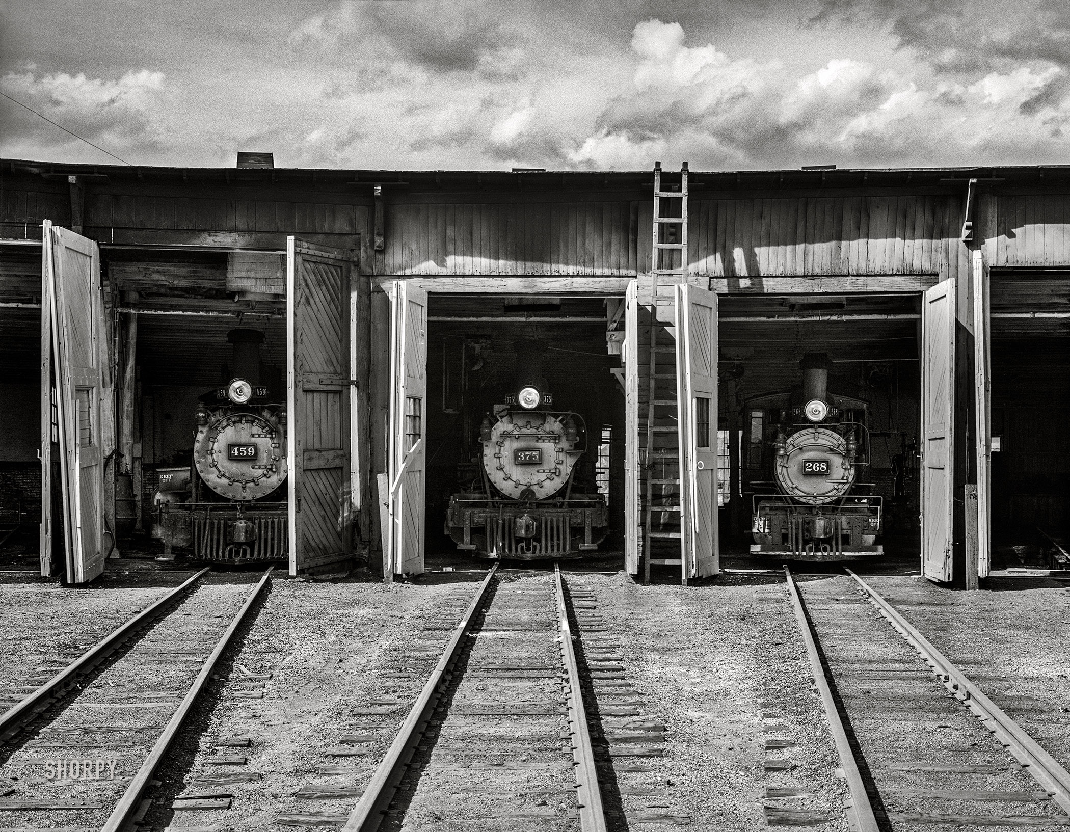 September 1940. "Locomotives in roundhouse. Durango, Colorado." Medium format acetate negative by Russell Lee for the Farm Security Administration. View full size.
