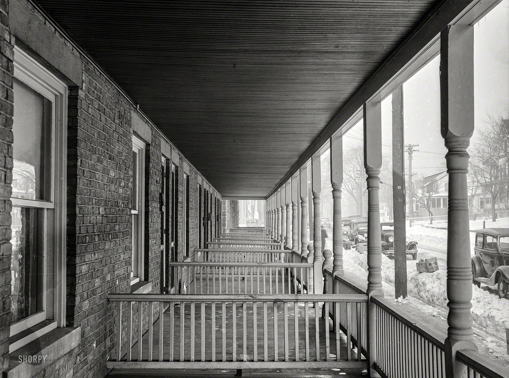 February 1936. "Back porches of identical houses in Bound Brook, New Jersey." Welcome to the M.C. Escher Rest Home. Photo by Carl Mydans. View full size.