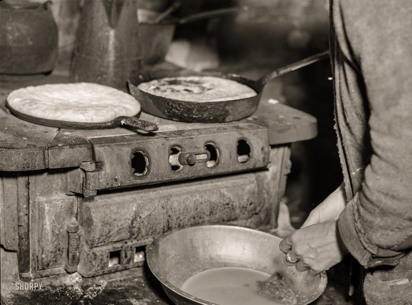 October 1935. "Making cornbread with relief flour. Shenandoah National Park, Virginia." Medium format negative by Arthur Rothstein. View full size.
