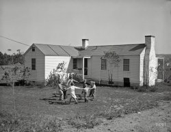 October 1934. "Children in front of their new home. Reedsville, West Virginia." Photo by Elmer Johnson for the Resettlement Administration. View full size.