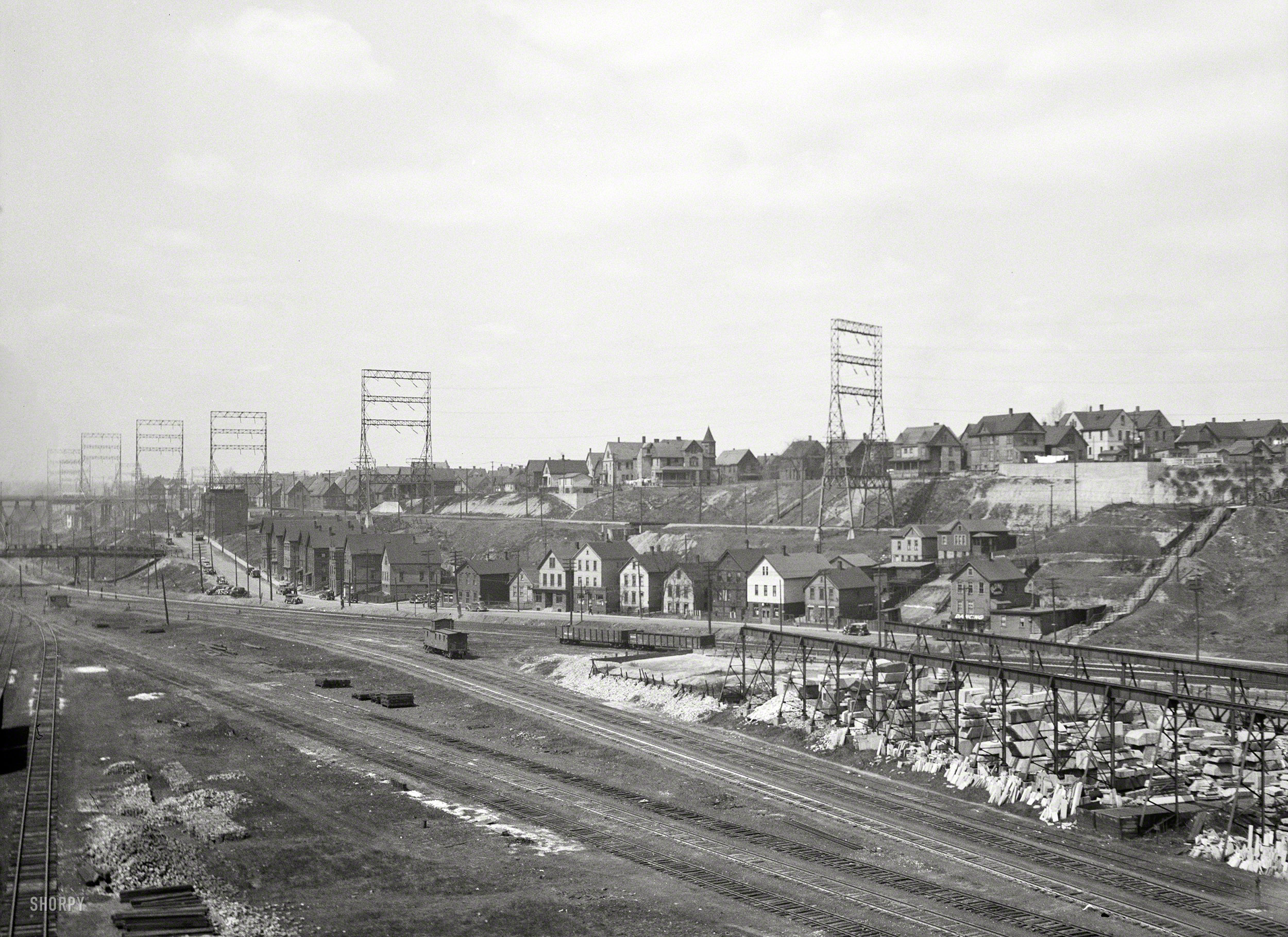 April 1936. "Chicago & Milwaukee tracks. Housing alongside electric railroad. Milwaukee freight yards and industrial plants overshadowed by residential district." Photo by Carl Mydans, Resettlement Administration. View full size.