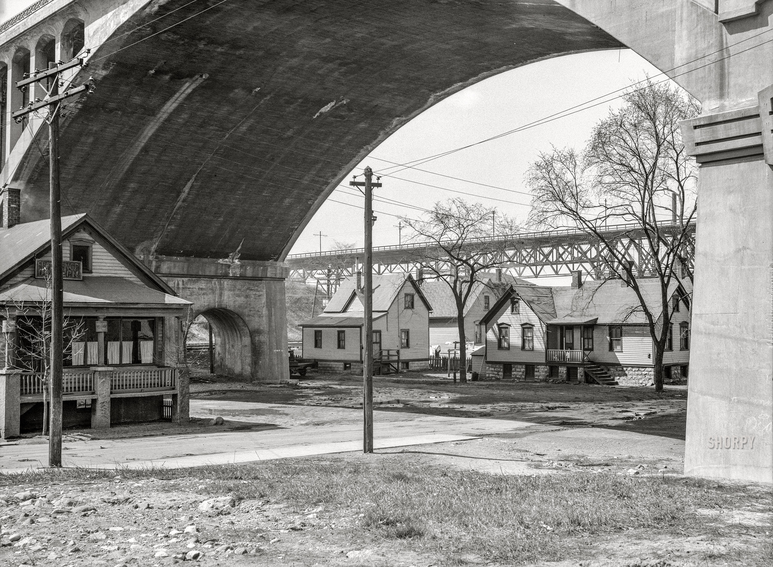 April 1936. "Housing conditions in crowded parts of Milwaukee. Housing under the Wisconsin Avenue viaduct." Another look at the F. Knop Tavern, last seen here. Nitrate negative by Carl Mydans for the Resettlement Administration. View full size.