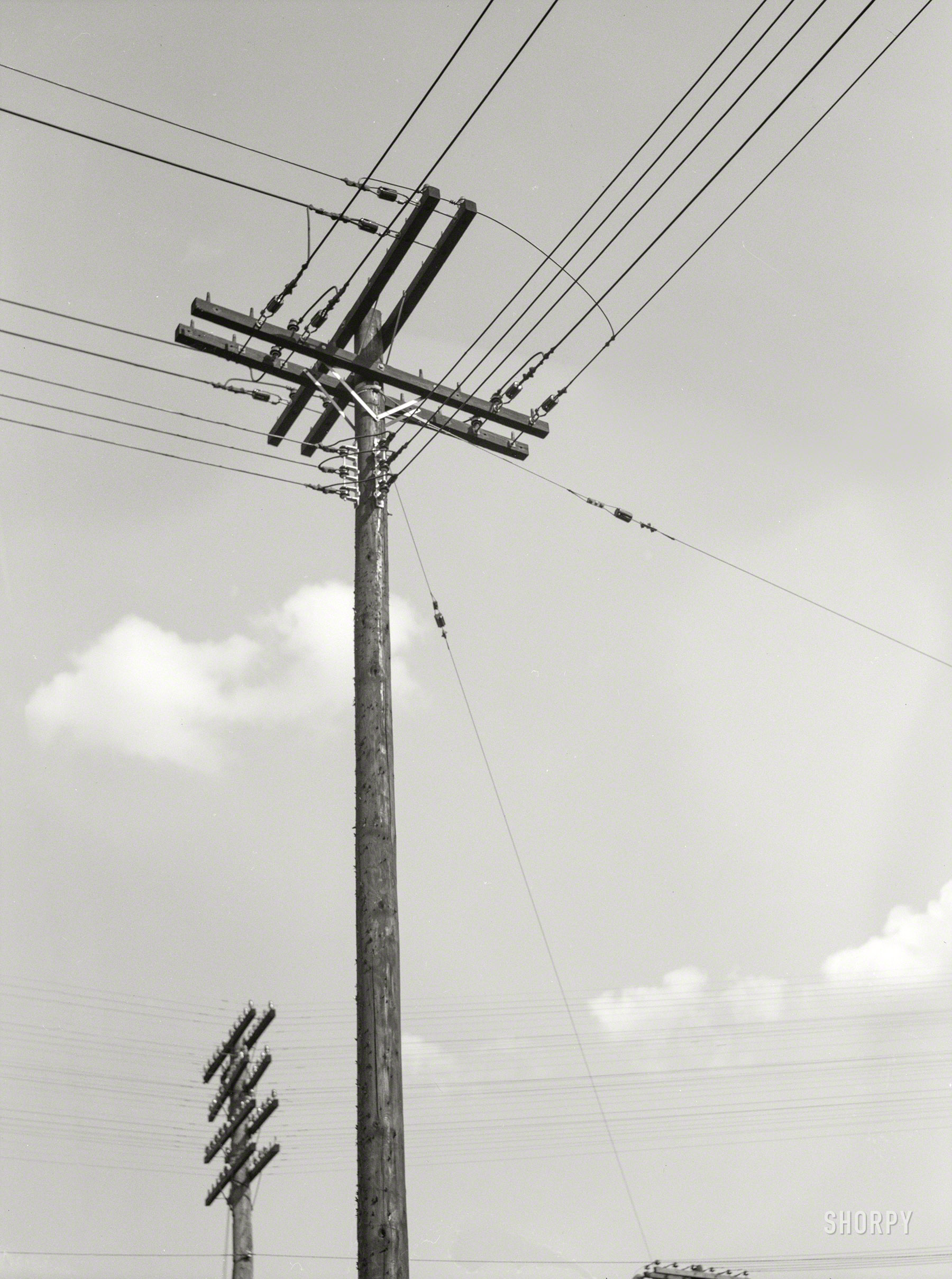 July 1937. "Electrical and telephone wires. Rosslyn, Virginia." Medium format negative by John Vachon for the Farm Security Administration. View full size.