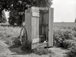 August 1938. "Privy on wheels for use of field workers at the King Farm near Morrisville, Pennsylvania." Why Mother always made you wash your hands, and your vegetables. Medium format negative by John Vachon. View full size.