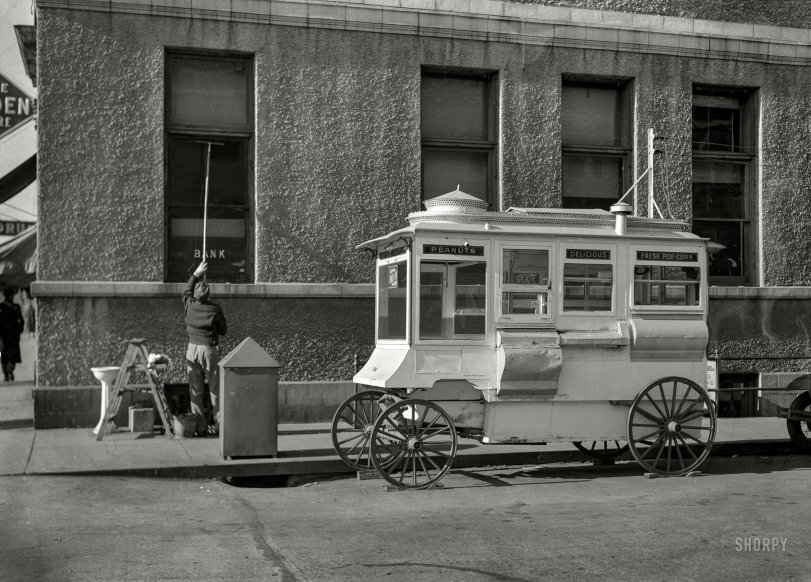 November 1936. "Street scene. Popcorn stand in Ames, Iowa." Medium format negative by Russell Lee for the Resettlement Administration. View full size.
