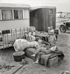 May 1937. "Children from Chickasaw, Oklahoma, in a potato pickers' camp near Shafter, California." Medium format nitrate negative by Dorothea Lange for the Farm Security Administration. View full size.