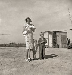 November 1938. "Family of rural rehabilitation client (last seen here). Tulare County, Calif. Husband also works about ten days a month outside the farm, is 26 years old, wife 22, three small children. Been in California five years." Photo by Dorothea Lange for the Resettlement Administration. View full size.