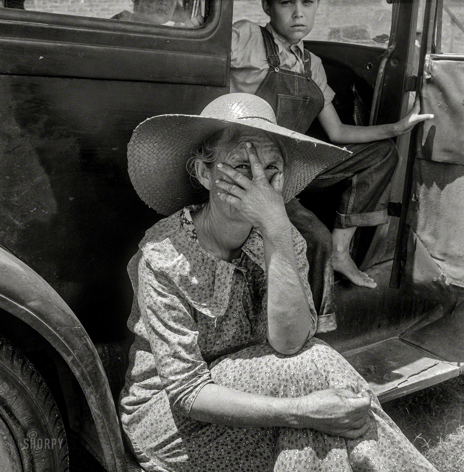 July 1938. Douglas, Georgia. "Wife of sharecropper in town to sell their crop at the tobacco auction." Medium format negative by Dorothea Lange. View full size.