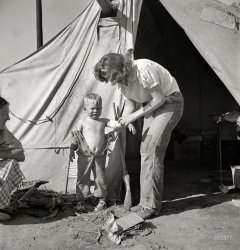 February 1939. "In a carrot pullers' camp, Imperial Valley, California, near Holtville. Women from Broken Bow, Oklahoma." Medium format negative by Dorothea Lange for the Farm Security Administration. View full size.
