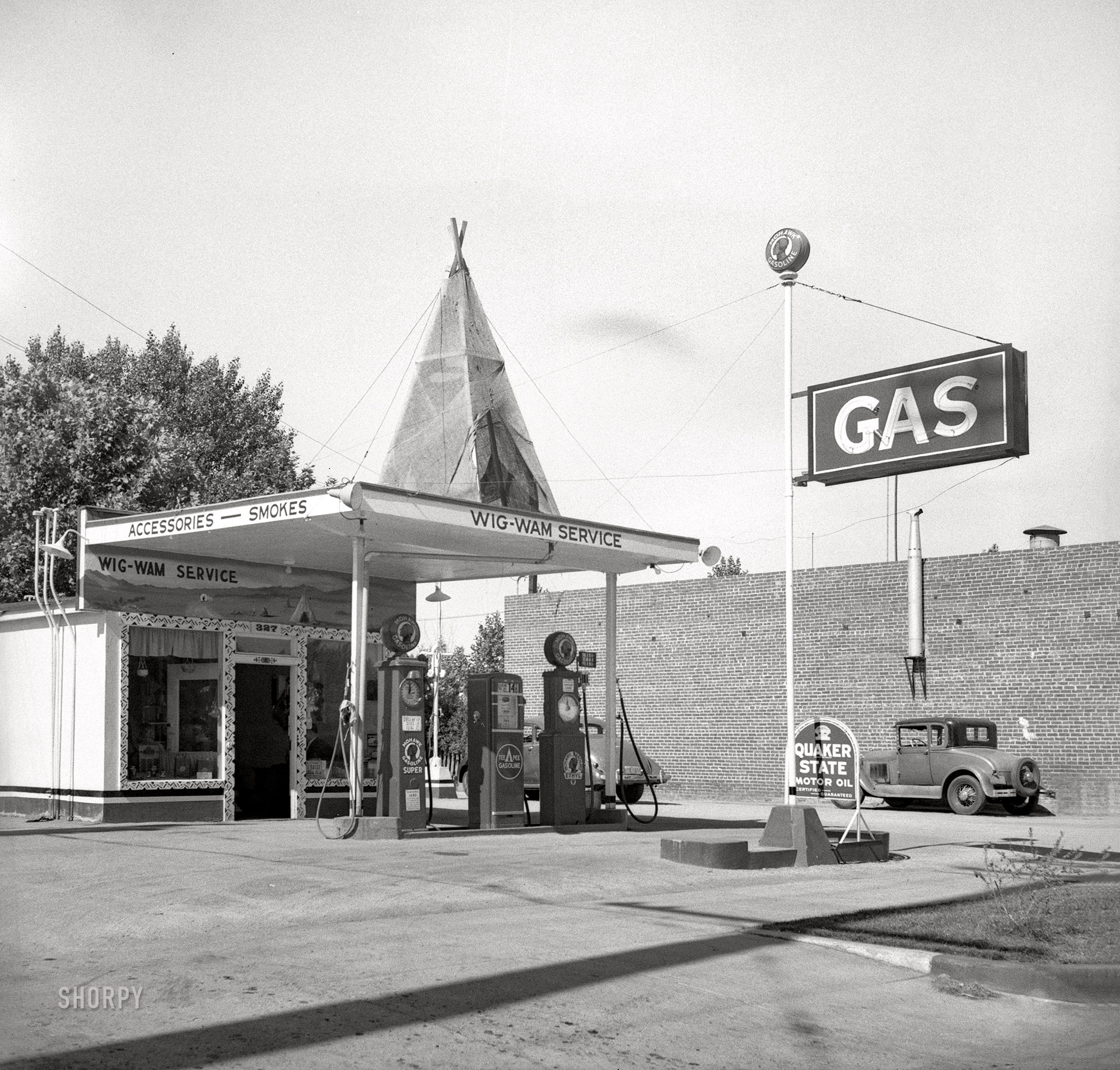 May 1939. "Gas station between Tulare and Fresno on U.S. 99." Medium format acetate negative by Dorothea Lange for the Farm Security Administration. View full size.