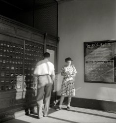 July 1939. "In the post office on a Saturday afternoon. Pittsboro, North Carolina." Medium format nitrate negative by Dorothea Lange. View full size.