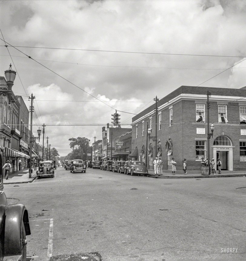 July 1939. "The main street, Chatham Avenue, of Siler City, North Carolina." Photo by Dorothea Lange for the Farm Security Administration. View full size.