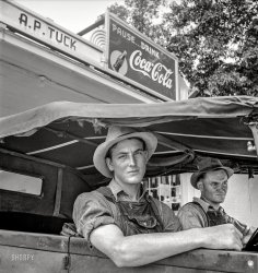 July 1939. "Young North Carolinian in old Ford. He does not farm. 'Works for wages.' At Tuck's filling station. Person County, N.C." Medium format negative by Dorothea Lange for the Farm Security Administration. View full size.