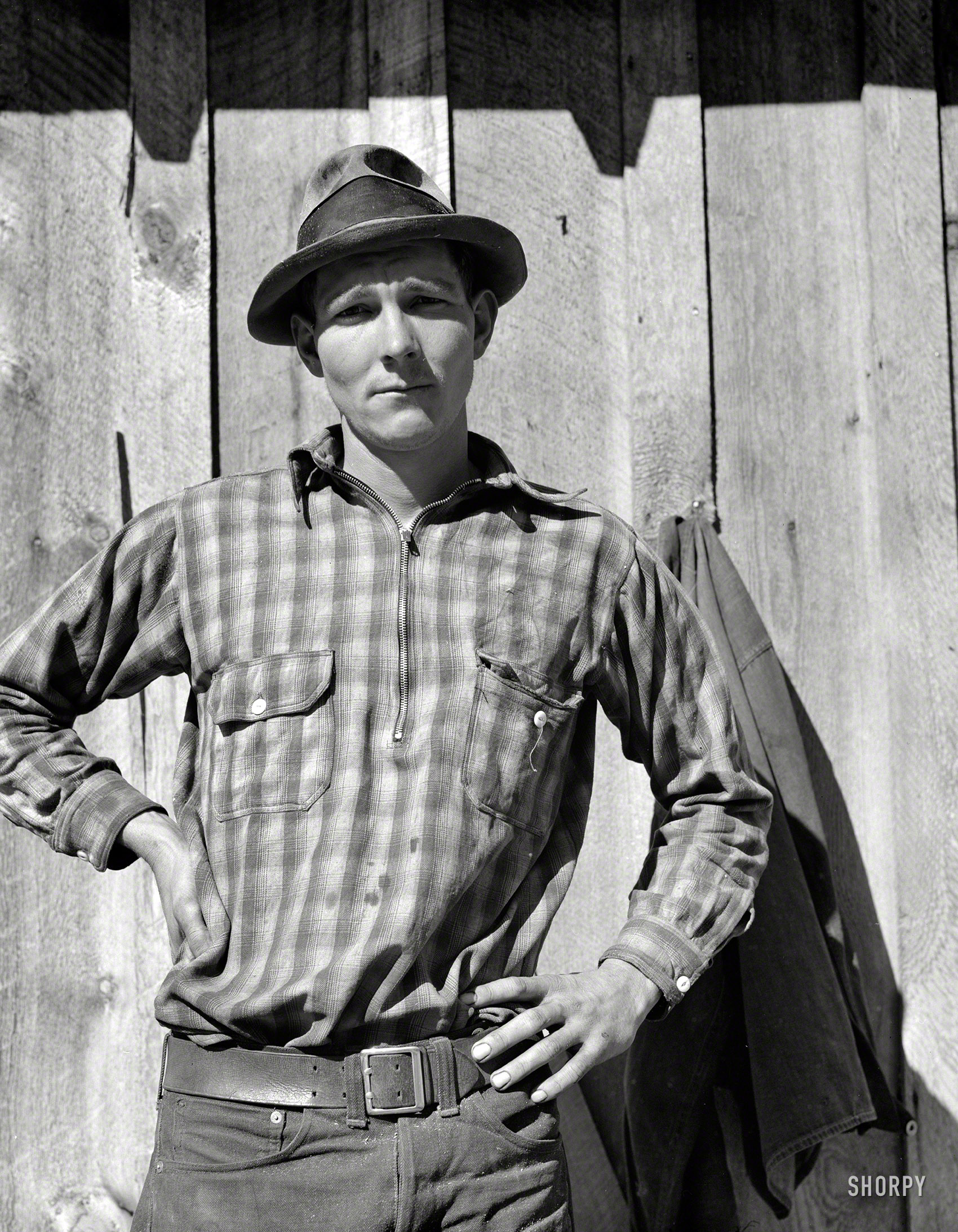 October 1939. "One of 36 members of the Ola self-help sawmill cooperative. Sawmill started with an FSA loan. Gem County, Idaho." Photo by Dorothea Lange for the Farm Security Administration. View full size.