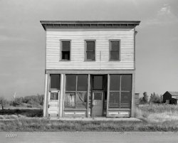 August 1937. "Abandoned store building and old sidewalk on what was the main street. Gemmel, Minnesota." Don't miss our big Fall Sale! Medium format negative by Russell Lee for the Resettlement Administration. View full size.