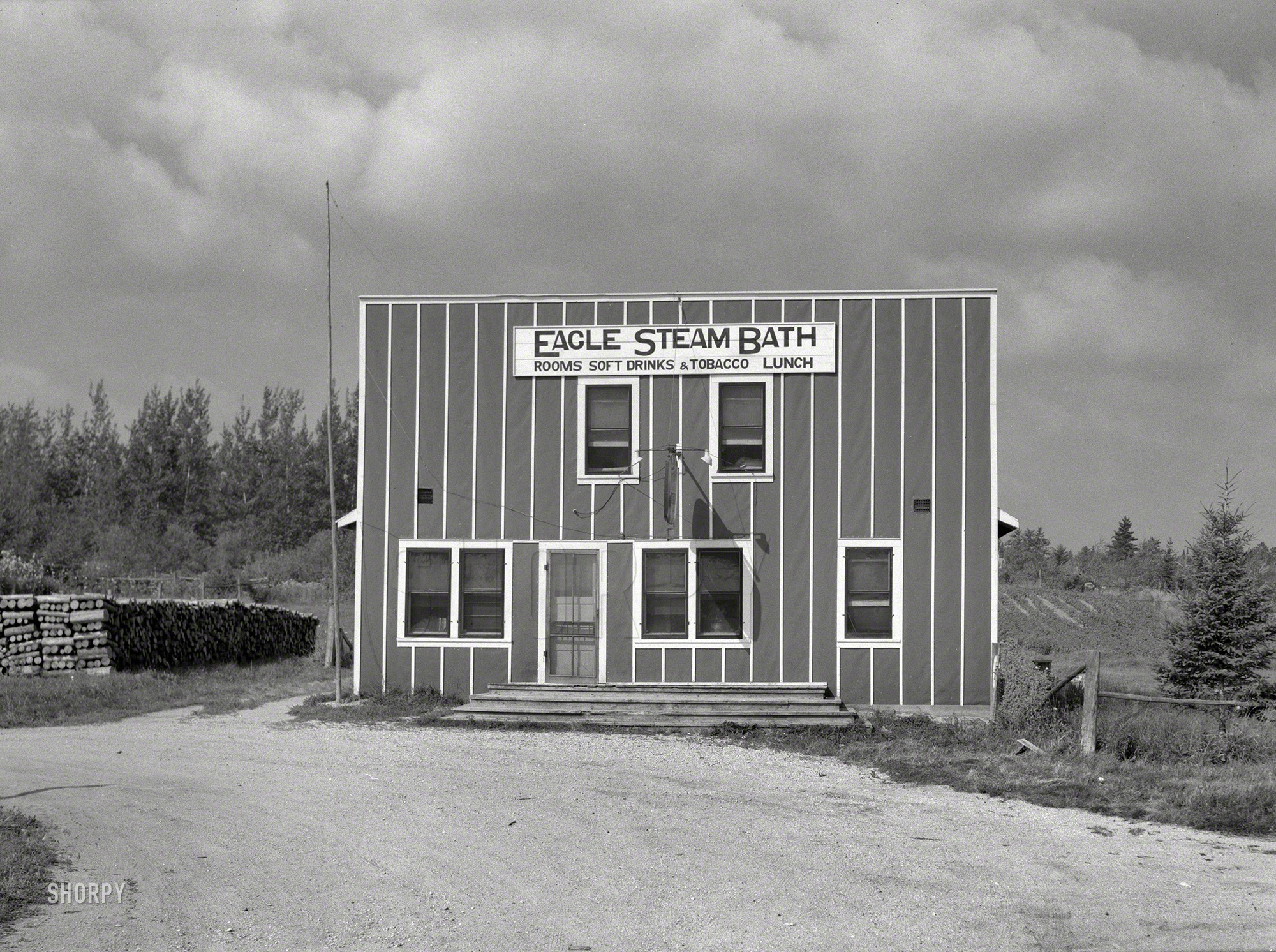 August 1937. "Steam baths are very popular among the lumberjacks near Craig&shy;ville, Minnesota." After your schvitz, try the Tobacco Lunch. Medium format negative by Russell Lee for the Resettlement Administration. View full size.