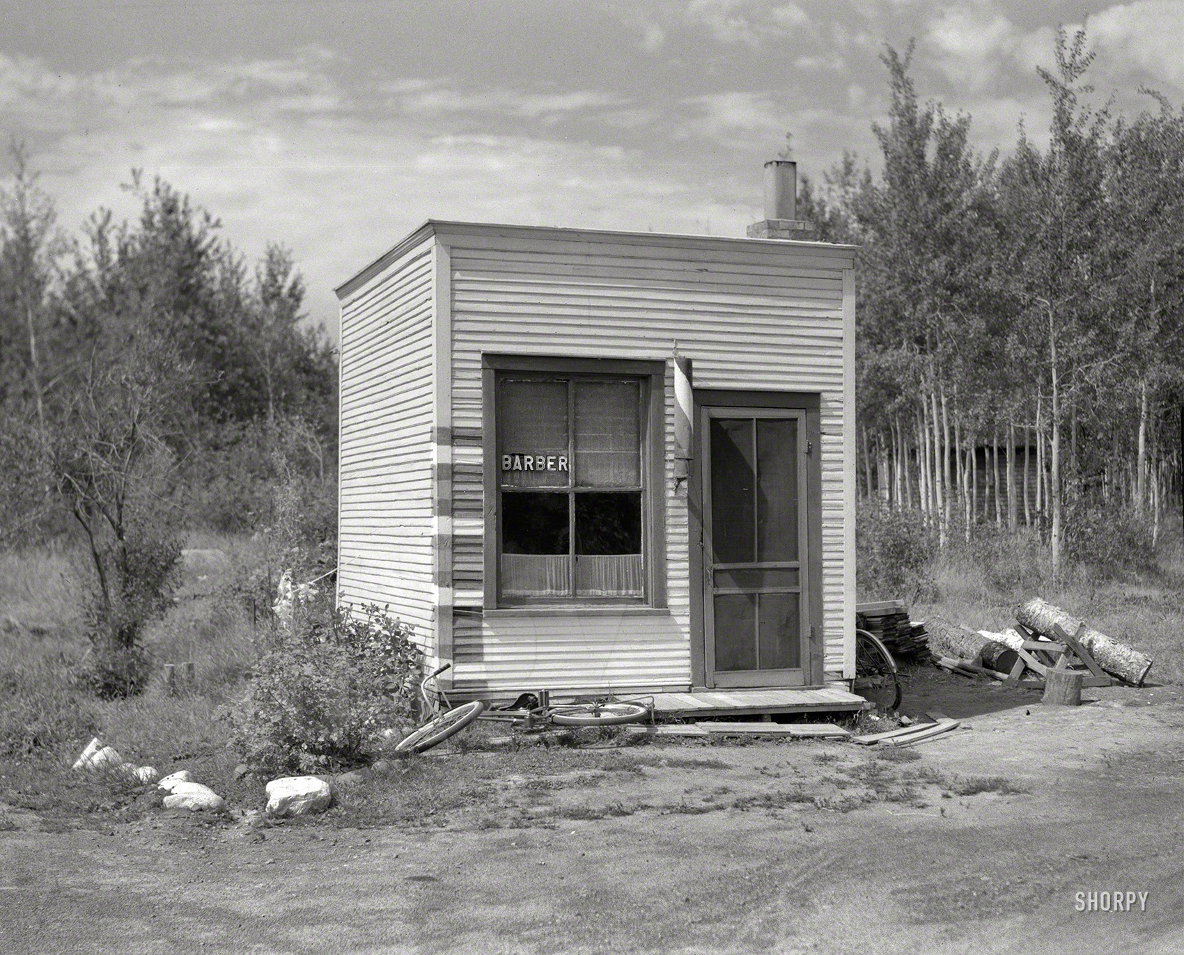 August 1937. "Barbershop in village of Twig, Minnesota." Medium format nitrate negative by Russell Lee for the Resettlement Administration. View full size.