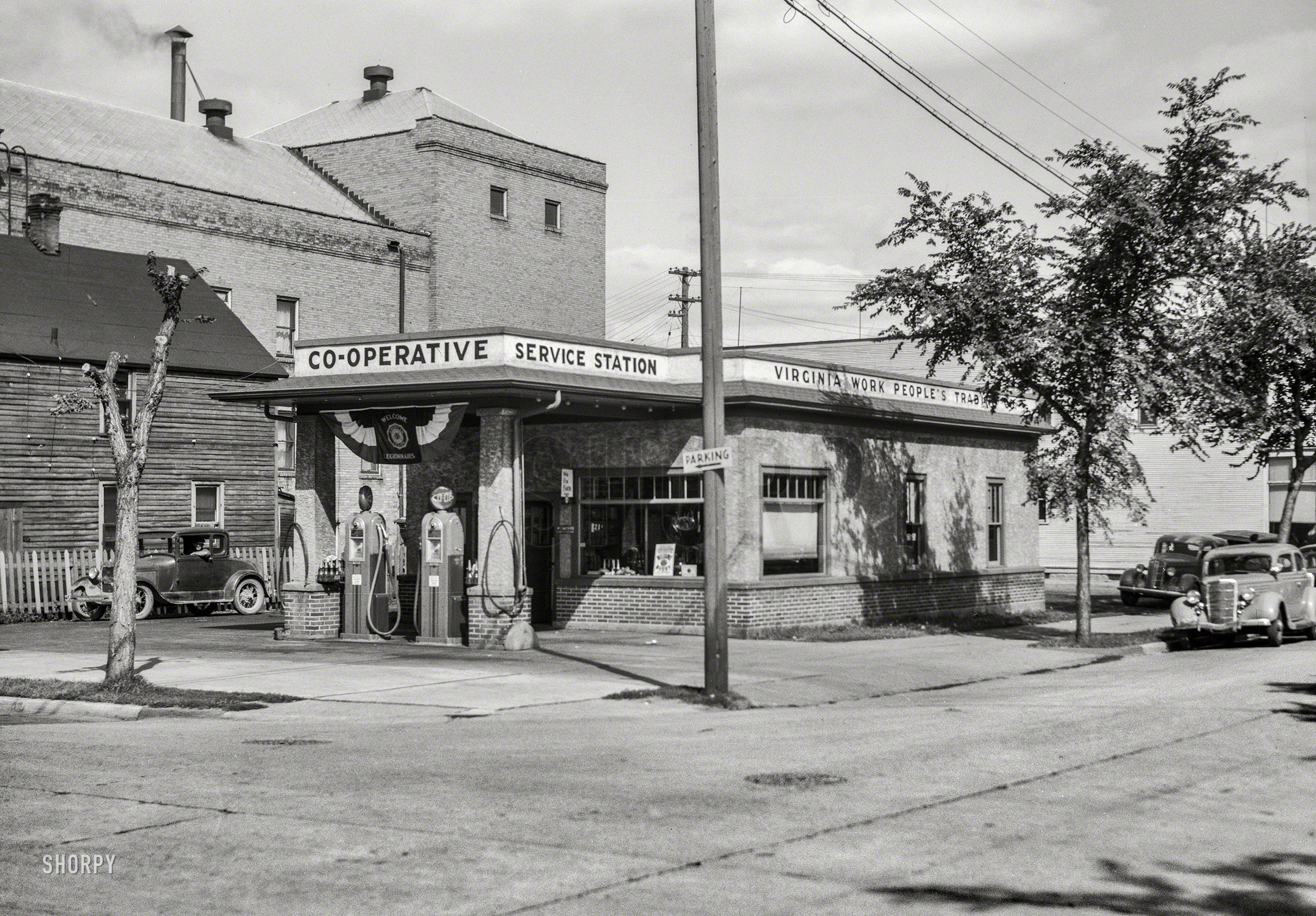 August 1937. "Virginia, Minnesota -- cooperative service station of the Virginia Work People's Trading Company." One manifestation of the Iron Range consumer cooperative movement started by Finnish immigrants. Photo by Russell Lee for the Resettlement Administration. View full size.