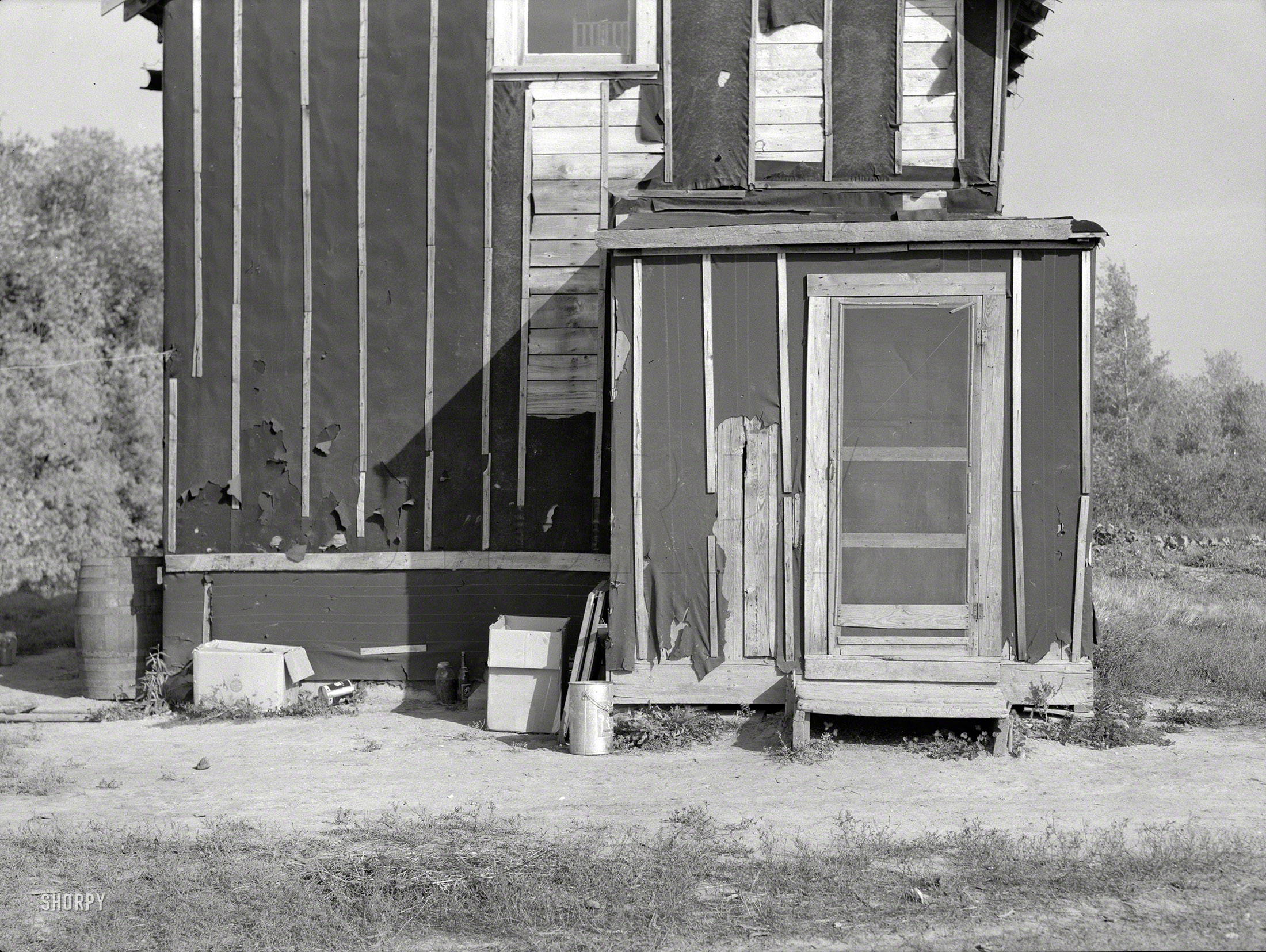 September 1937. Koochiching County, Minnesota. "Farmhouse on cut-over land near Northome." Medium format negative by Russell Lee for the Resettlement Administration. View full size.