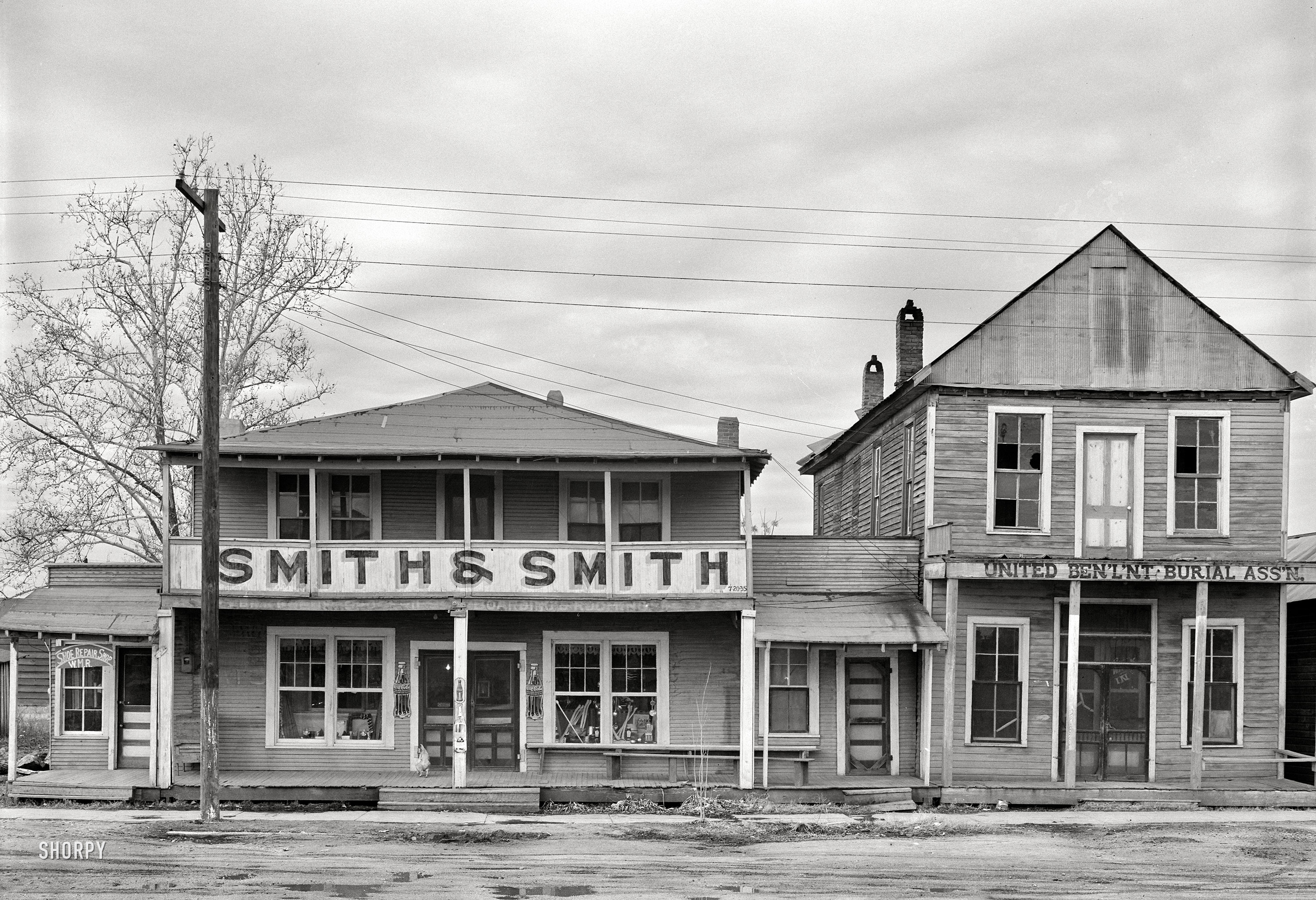 January 1939. "Businesses in Mound Bayou, Mississippi." Medium format negative by Russell Lee for the Farm Security Administration. View full size.
