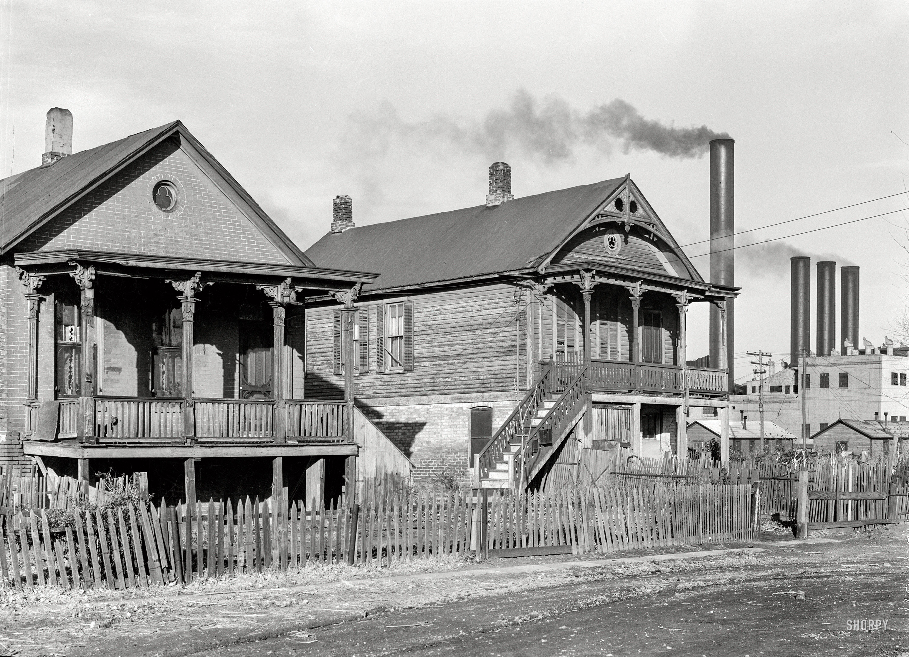 November 1938. "Houses near the Nebraska Power Company plant, Omaha." Photo by John Vachon for the Resettlement Administration. View full size.