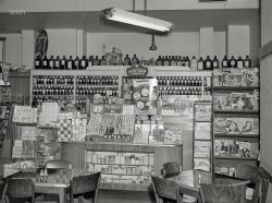 March 1942. Washington, D.C. "Interior of a drugstore on 14th Street N.W." Medium format acetate negative by John Ferrell for the Office of War Information. View full size.