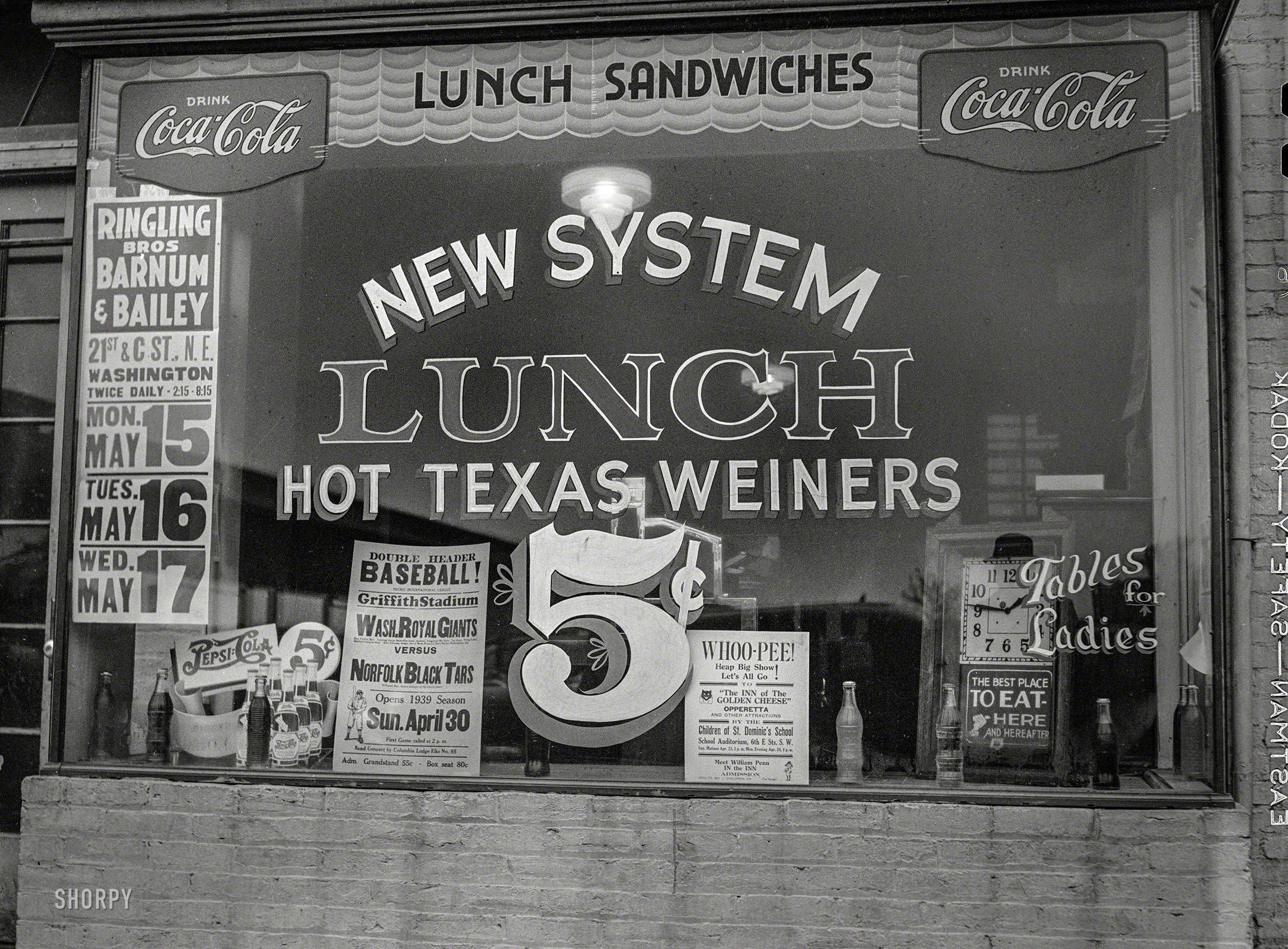 Spring 1939. "Washington, D.C., lunchroom." Offering, in addition to Lone Star tube steaks, "Tables for Ladies." Medium format acetate negative. View full size.