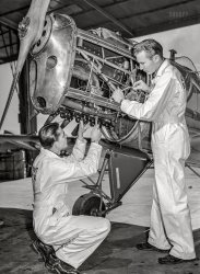 January 1942. Fort Worth, Texas. "Meacham Field. Students working on plane motor at civilian pilot training school." Photo by Arthur Rothstein, Office of War Information. View full size.
