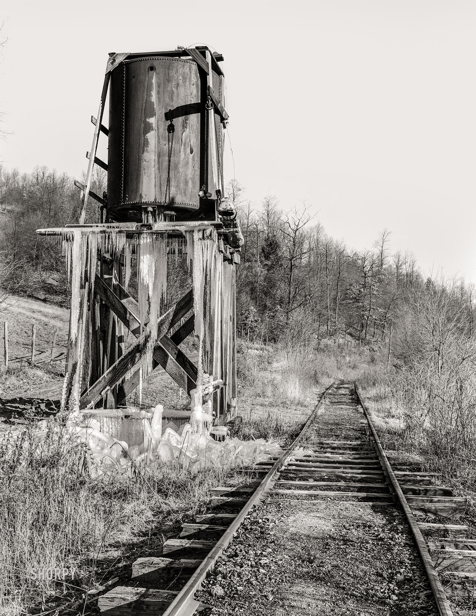 December 1937. "Water tower on railroad through Jennings, Maryland. The train now runs only once a week." Medium format acetate negative by Arthur Rothstein. View full size.
