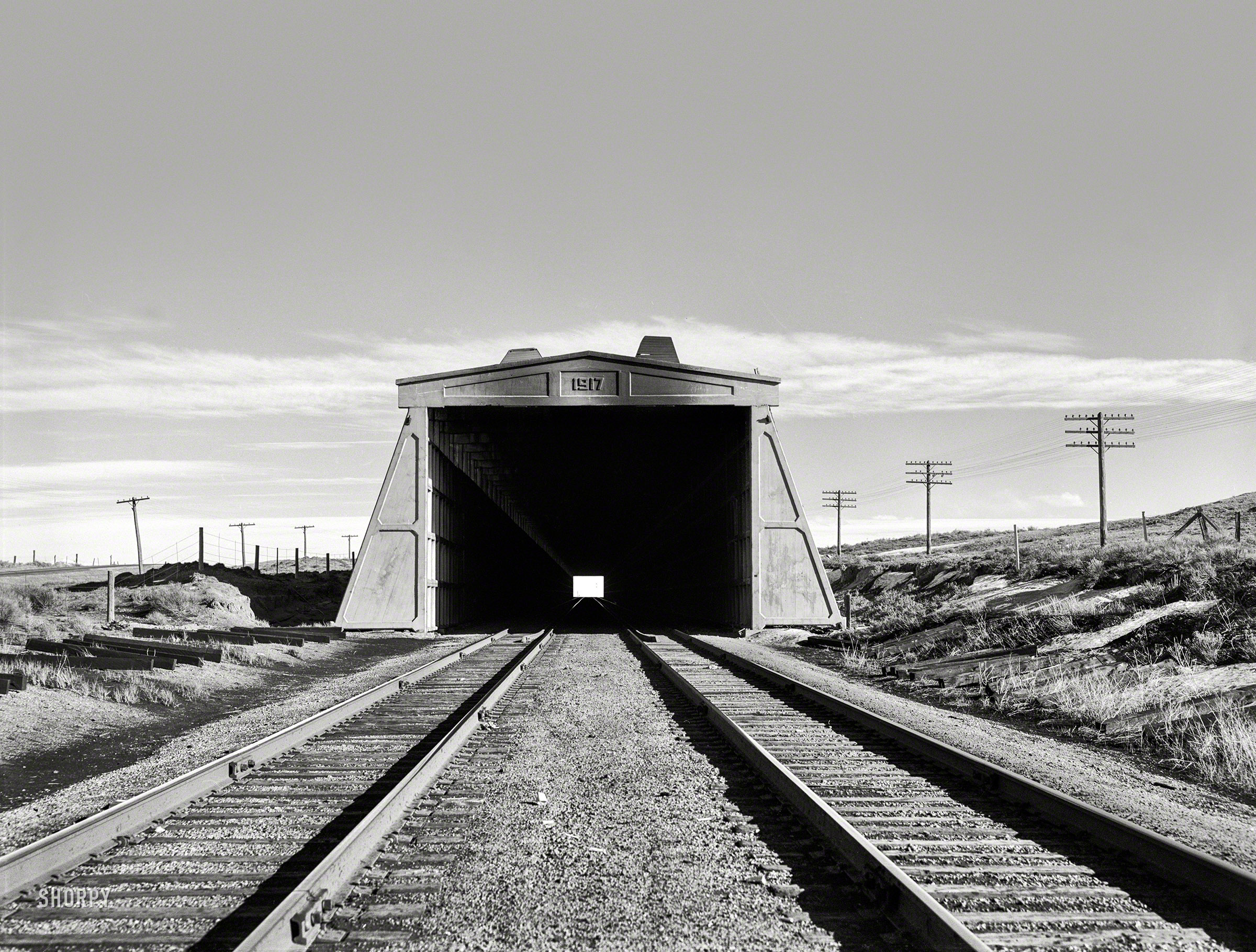 March 1940. "Snow shed over Union Pacific tracks. Carbon County, Wyoming." Photo by Arthur Rothstein for the Farm Security Administration. View full size.