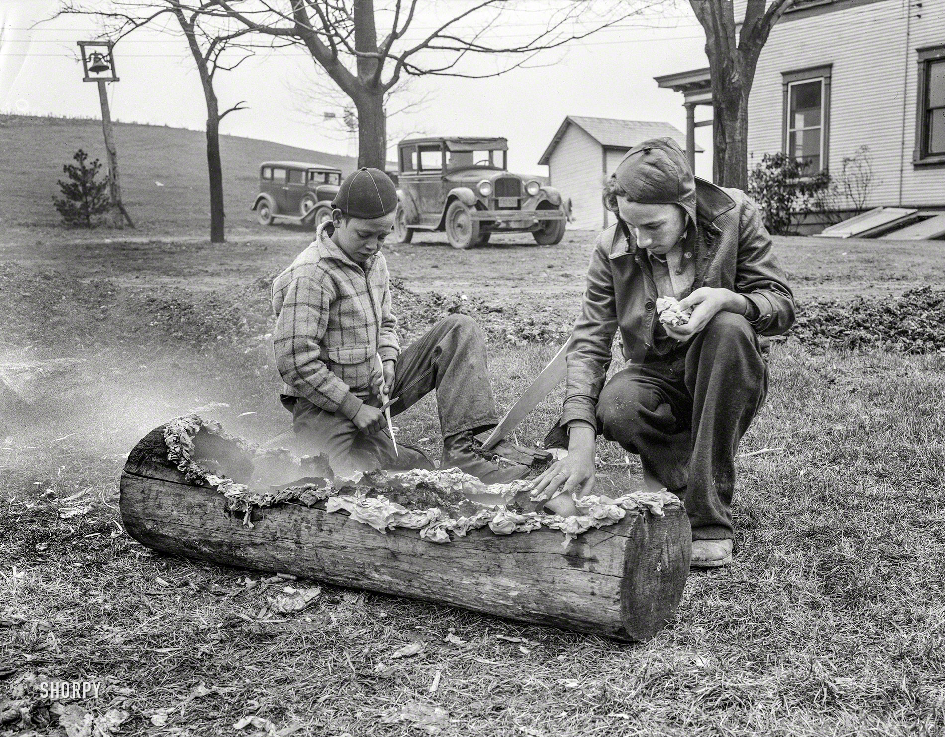 April 1935. "Boys smoking log. Reedsville, West Virginia." Back before transistors or whatever made these portable. 4x5 nitrate negative by Elmer Johnson for the Resettlement Administration. View full size.