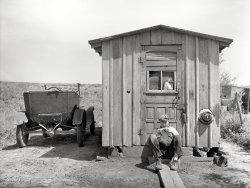 May 1936. "Home of worker in strip coal mine. Cherokee County, Kansas." Photo by Arthur Rothstein for the Resettlement Administration. View full size.
The Balkans of KansasMy home town of Columbus, Kansas is the county seat of Cherokee County so I am very familiar with the history of coal mining in that county and also the lead and zinc mines in the southeastern corner of that county. Coal production in that area began shortly after 1865 and was in full production by 1900. Cherokee and Crawford counties were often referred to as " The Balkans of Kansas" due to the number of immigrant coal miners into that area. The original mines were deep shaft mines but, later on, the coal was recovered by strip mining. The old strip mines have filled with water over the years and have been used for recreational fishing and camping for a number of years. Others have been reclaimed and are now farmland again. One point of attraction in Cherokee County is Big Brutus which was the worlds largest shovel and has been restored as a museum of the coal mining days. For more information about Big Brutus go to www.bigbrutus.org
(The Gallery, Arthur Rothstein, Cars, Trucks, Buses, Mining)