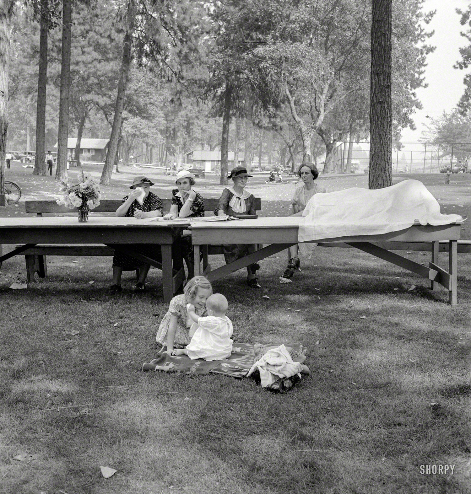 August 1939. "Grants Pass, Oregon. 'California Day.' A picnic in town park on the Rogue River. Hot summer afternoon." Photo by Dorothea Lange. View full size.