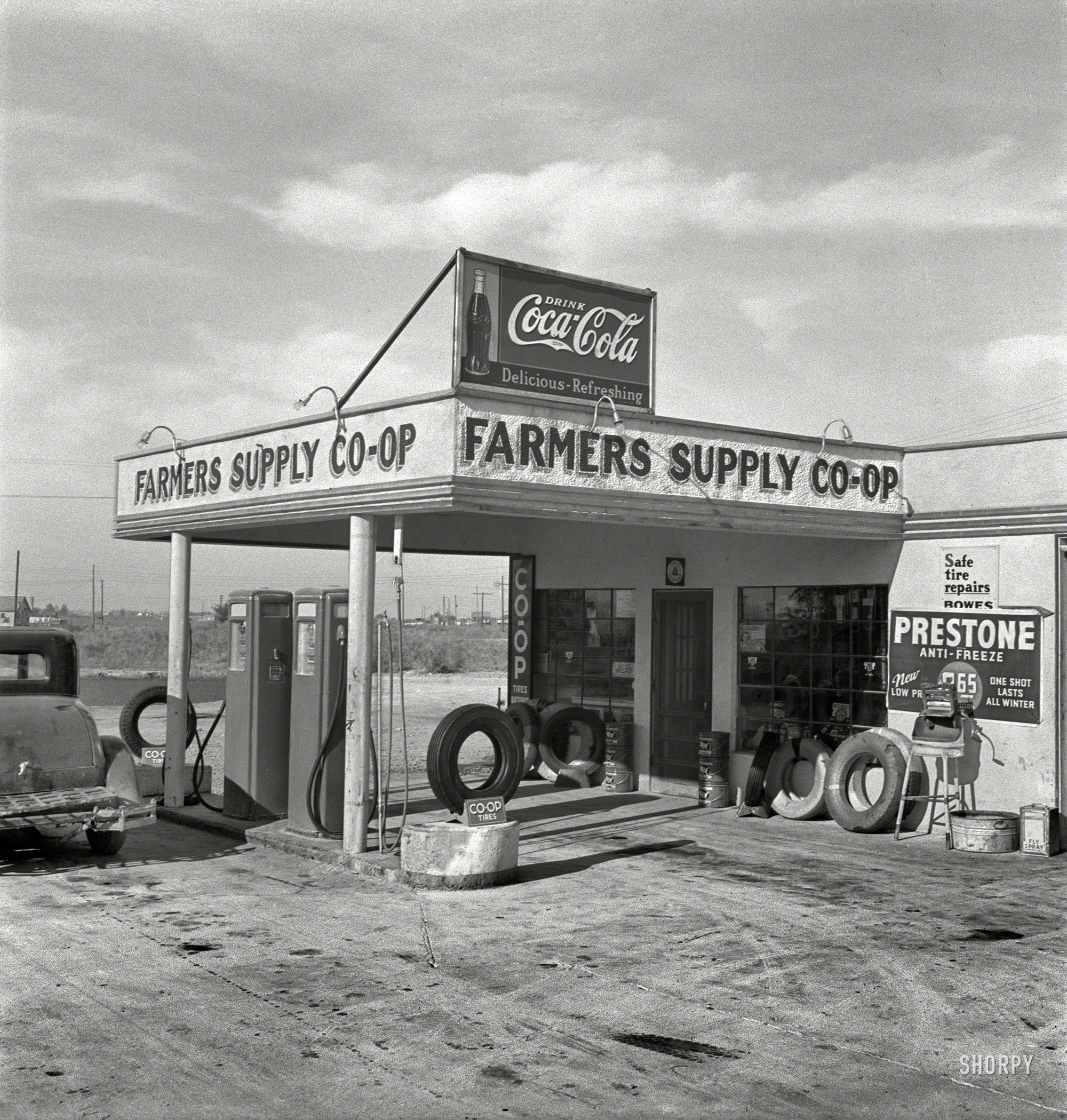 October 1939. "Farmers' supply co-op. Nyssa, Malheur County, Oregon." Photo by Dorothea Lange for the Farm Security Administration. View full size.