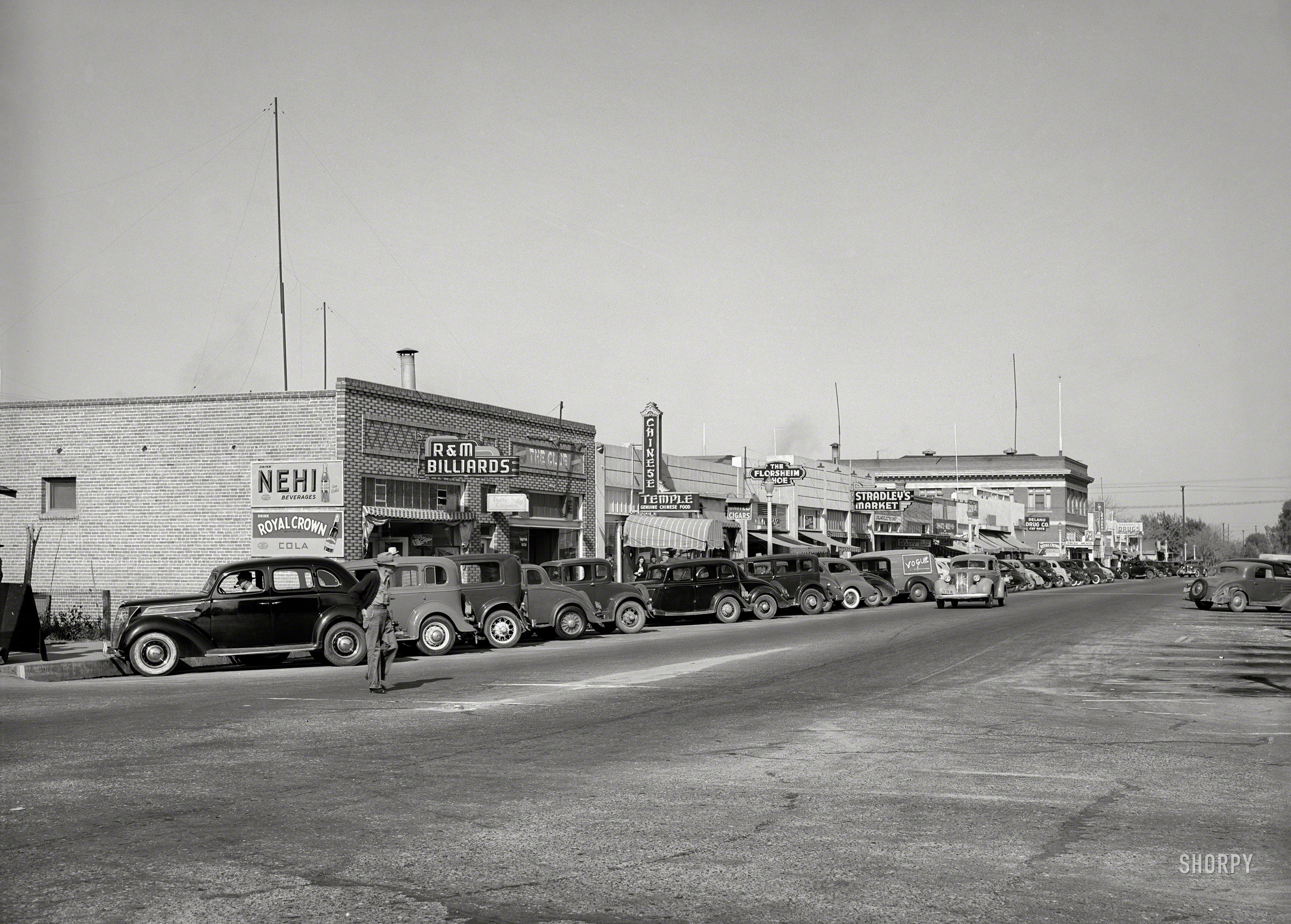 November 1940. "Main street. Delano, California." Medium format negative by Russell Lee for the Farm Security Administration. View full size.
