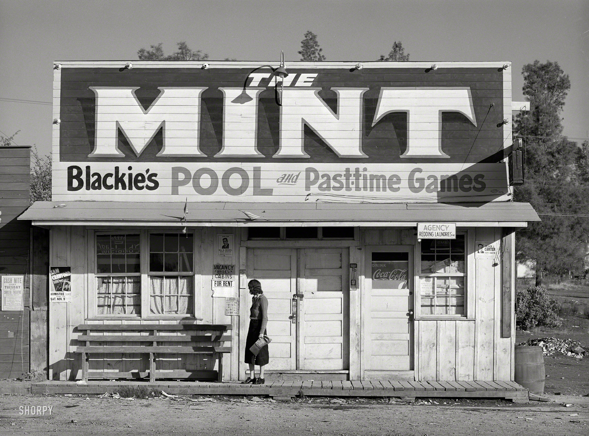 November 1940. "Pool hall and game parlor in Central Valley, California. This is one of the boom towns near Shasta Dam." Medium format acetate negative by Russell Lee for the Farm Security Administration. View full size.