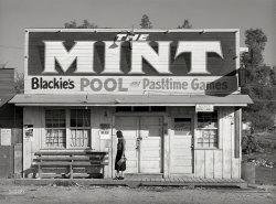November 1940. "Pool hall and game parlor in Central Valley, California. This is one of the boom towns near Shasta Dam." Medium format acetate negative by Russell Lee for the Farm Security Administration. View full size.
Sam Crawford, don&#039;t miss himIn a few days he will be in Oregon!
The Evening Herald from Klamath Falls, Oregon - Tuesday, November 12, 1940· Page 2:
Dance with Sam Crawford and his 14-piece band
Oliver CarterThe senator (and later judge) whose campaign poster is seen here would go on to preside over the Patty Hearst trial. 
ElectionDemocrat Oliver J Carter beat write-in candidate William Menzel, to serve in the State Legislature 5th District from 1941 to 1949.
Interestingly, he won the seat when his father, who had held the seat prior, was appointed to the California Supreme Court.  Carter later became a judge himself.
https://en.wikipedia.org/wiki/Jesse_W._Carter
https://en.wikipedia.org/wiki/Oliver_Jesse_Carter
https://en.wikipedia.org/wiki/Members_of_the_California_State_Legislatur...
Menzel was one of the early clients of Whitaker and Baxter, one of the first campaign consultants.
https://en.wikipedia.org/wiki/Whitaker_and_Baxter
https://oac.cdlib.org/findaid/ark:/13030/kt7p3036z9/dsc/#c02-1.3.7.2.20
There was a William Menzel mentioned in this issue of the SF Call of 1911-06-18, which says he was a wealthy businessman who lived in Redding - a town near the site of the Shasta Dam - and bailed out an indicted bank president.  That was 29 years prior, so perhaps it was his father, or maybe candidate Menzel used a rather old picture on his campaign fliers.
https://chroniclingamerica.loc.gov/lccn/sn85066387/1911-06-18/ed-1/seq-4...
The Shasta Dam was under construction when this taken - it opened in 1945
https://en.wikipedia.org/wiki/Shasta_Dam
Carter Wins Senate Race!California State Senator Committees.  1941
   CARTER - Public Health and Safety (Vice Chairman), Education, Fish and Game, Judiciary, Water Resources
Dead OneLooks like someone was trying to decorate the porch roof with an empty whiskey bottle. Dag nabbed ruffians!!
Minty FreshBold, with delicate overtones of outline! I love how the lamp shadow mimics the exquisite drop shadow. The typeface below seems to have roots in our modern typeface 'Hobo'. And by modern, I mean designed in 1915. One question: Why would you climb all the way up there to remove a dead lightbulb and not replace it?
(The Gallery, Russell Lee)